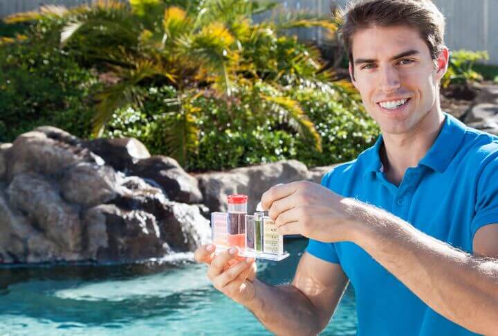 Pool technician testing water chemistry
